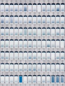 A building with many windows and a blue door